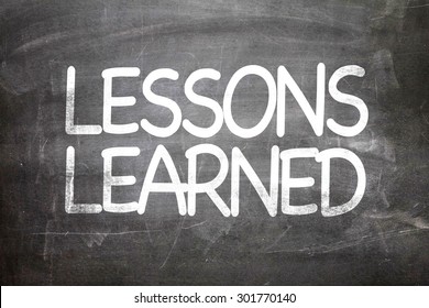 Lessons Learned written on a chalkboard