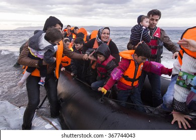 Lesvos Island, Greece - 29 October 2015. Syrian Migrants / Refugees Arrive From Turkey On Boat Through Sea With Cold Water Near Molyvos, Lesbos On An Overload Dinghy. Leaving Syria That Has War.