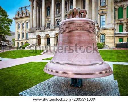 Let Freedom Ring! Historic Liberty Bell in front of the Illinois State Capitol Building in Springfield, Illinois, USA.