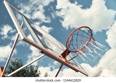 Let the game begin. Shot of basketball hoop with sky in the background outdoors
