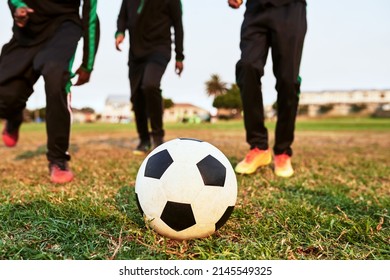Let the games begin. Closeup shot of a group of young boys playing soccer on a sports field.