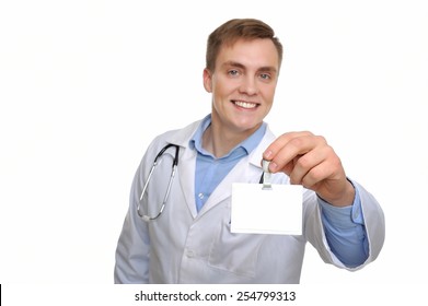 Let Me Introduce Myself. Attractive Young Doctor Showing His Name Tag. Copy Space On The Name Tag Can Be Used For Your Text.