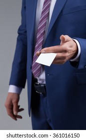 Let Me Introduce Myself. Close Up Of Businessman Is Giving His Business Card To His Colleague