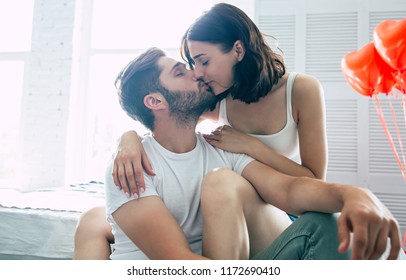Let me kissing you always. Beautiful couple are kissing in bedroom. - Shutterstock ID 1172690410