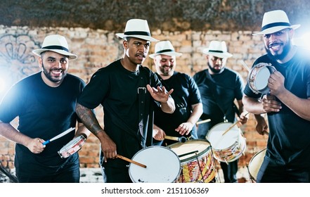 Let The Music Grab You. Cropped Shot Of A Group Of Men Drummers Playing Music Outside.