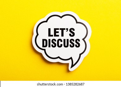 Let s Us Discuss speech bubble isolated on the yellow background. - Shutterstock ID 1385282687