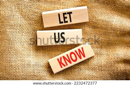 Let us know symbol. Concept words Let us know on wooden blocks on a beautiful canvas table canvas background. Business and let us know concept. Copy space.