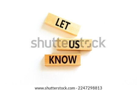 Let us know symbol. Concept words Let us know on wooden blocks on a beautiful white table white background. Business and let us know concept. Copy space.