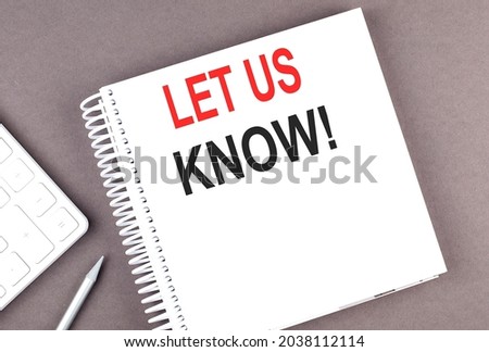 LET US KNOW text on notebook with calculator and pen