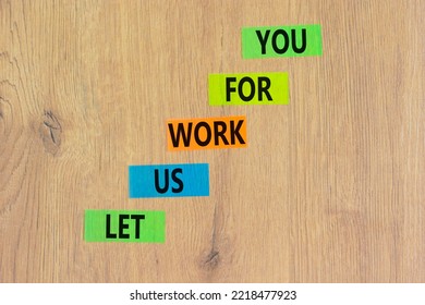 Let Us Work For You Symbol. Concept Words Let Us Work For You On Colored Paper. Beautiful Wooden Background. Business And Let Us Work For You Concept. Copy Space.