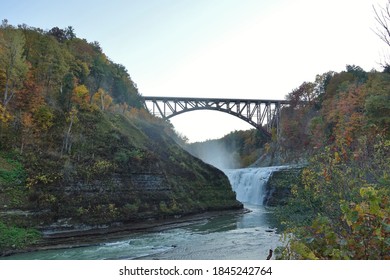 LETCHWORTH STATE PARK, NY –17 OCT 2020- View of the landmark Genesee Arch Bridge in Letchworth State Park in Castile, New York, during foliage season in autumn