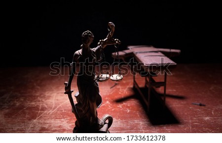 Lethal injection concept. Prisoner handcuffed to death by lethal injection. Creative artwork decoration with scale model on dark with lights.