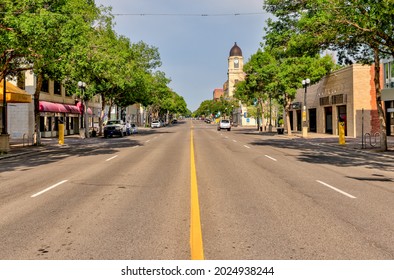 Lethbridge, Alberta - July 6, 2021: Looking down the middle of an empty street in Lethbridge Alberta