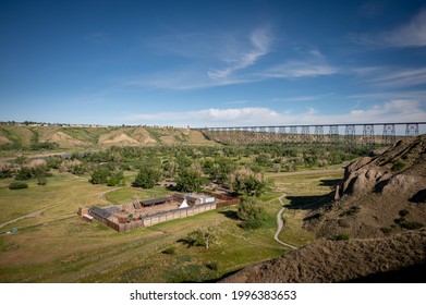 Lethbridge's Fort Whoop-up in summer with rail viaduct in the background.