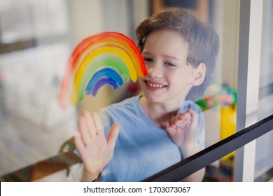 Let's All Be Well. Child At Home Draw  On The Window. Chase The Rainbow Quarantine Pandemic Coronavirus. Children Create Artist Paints Creativity Vacation