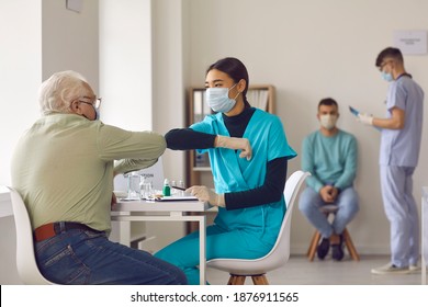 Let's beat the virus together. Doctors taking care of old people. Asian nurse in protective medical face mask bumping elbows with healthy senior man before administering Coronavirus or flu vaccine - Powered by Shutterstock