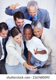 Lets Do A Fun Team Photo. Shot Of A Diverse Group Of Businesspeople Taking A Team Photo Of Themselves.