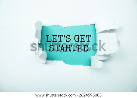 Let's Get Started message written on blue paper with torn paper background