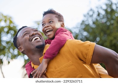 Lets go higher, dad. an adorable little boy enjoying a piggyback ride with his father in a garden. - Shutterstock ID 2293263711