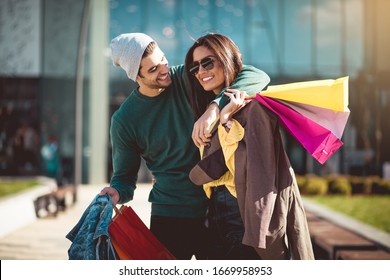 Let's Go Home To See What We Bought. Young Couple In Shopping.