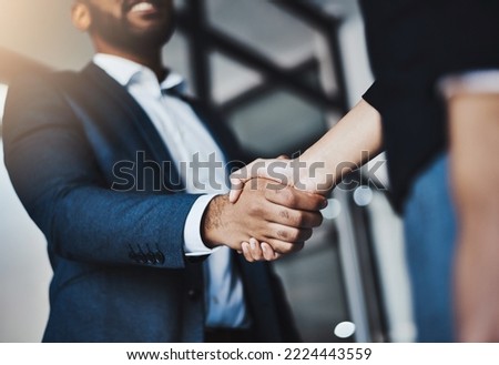 Lets join forces to become the best. Closeup shot of two unrecognizable businesspeople shaking hands in an office.