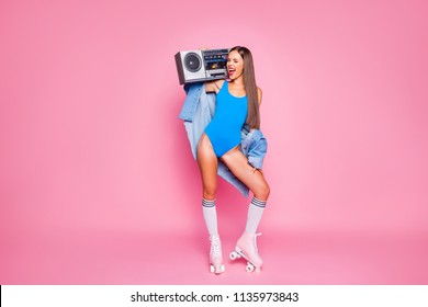 Let's make noise! Swag people person leisure hobby melody meloman concept. Full length body size photo of beautiful excited mad joyful girl holding tape radio on shoulder isolated pastel background