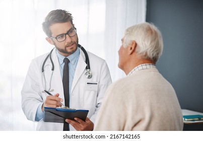 Lets set up an appointment for next week. Cropped shot of a young male doctor going through medical records with his senior male patient. - Shutterstock ID 2167142165