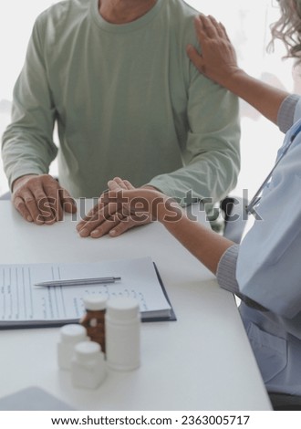 Lets set up an appointment for next week. Cropped shot of a young male doctor going through medical records with his senior male patient.