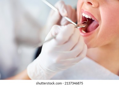 Lets Take A Closer Look. Closeup Shot Of A Young Girl Having A Checkup At The Dentist.