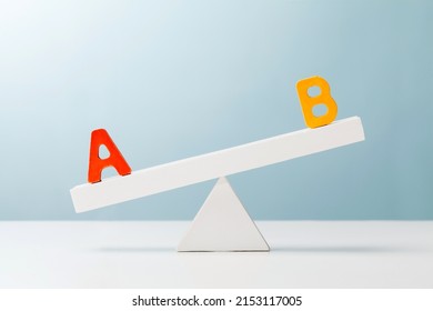 Letter A And B On The Unbalanced Seesaw. Evaluation Concept.