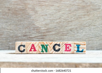 Letter block in word cancel on wood background