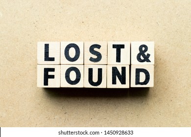 Letter block in word lost & found on wood background - Shutterstock ID 1450928633