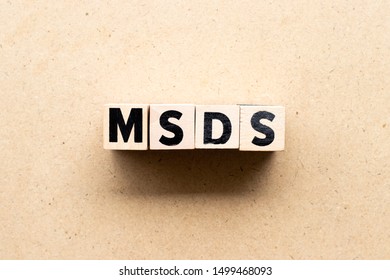 Letter Block In Word MSDS (Abbreviation Of Material Safety Data Sheet) On Wood Background