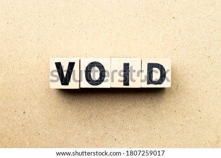 Letter block in word void on wood background