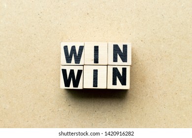 Letter Block In Word Win Win On Wood Background (Concept Of Game Theory)