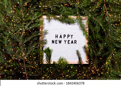 Letter board new year and christmas concept. Top horizontal view copyspace christmas decorations and fur tree.