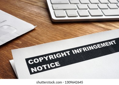 Letter With Copyright Infringement Notice On A Desk.