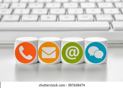 Letter dice in front of a keyboard - Contacting - Shutterstock ID 387658474
