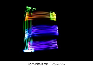 Letter E. Isolated figure on a black background. Freezelight.