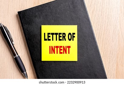 LETTER OF INTENT text on sticky on black notebook with pen - Shutterstock ID 2232900913