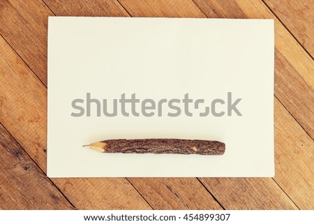 letter, message, mail and  inspiration concept - white blank paper sheet with wooden pen on table 