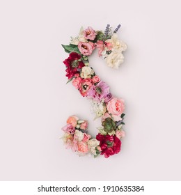 Letter S made of real natural flowers and leaves. Flower font concept. Unique collection of letters and numbers. Spring, summer and valentines creative idea.