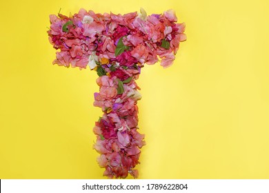 Letter T Flower Alphabet, Made From Colorful Bougainvillea Flowers, Wonderful Flora Letters For Unique Spring Decorations And Various Creation Ideas, Greeting Card Design Over On Yellow Background.