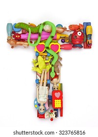 the letter    T  made from small toys
