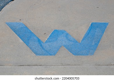 Letter W Painted On Sidewalk