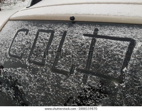 Lettering on a car in\
the snow. Snow theme
