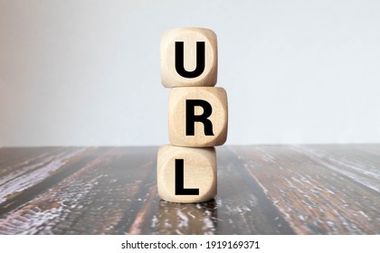 Letters abbreviation url www on wooden cubes, on a dark background, light wooden cubes signs, symbols signs, business office, site content