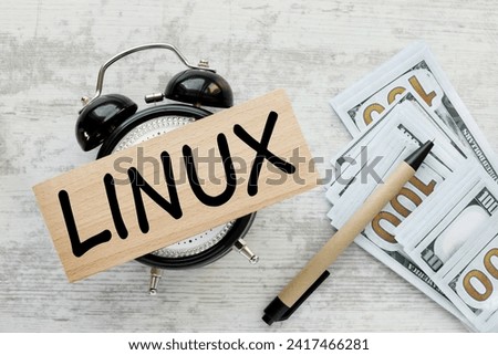 letters of the alphabet with the word Linux. Internet concept. Linux is a family of open source Unix-like operating systems, wooden block on desk clock