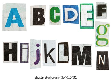 Letters cut out from newspaper isolated on white