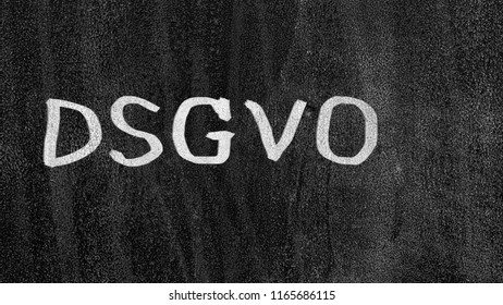 Letters "DSGVO" on a blackboard with chalk. Black chalkboard with the inscription DSGVO (Datenschutzgrundverordnung) in English GDPR (General Data Protection Regulation).